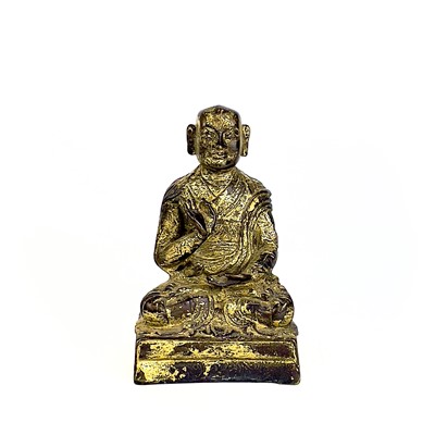 Lot 132 - A Chinese gilt bronze figure of a seated buddha, 18th/19th century.