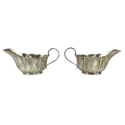 Lot 88 - A pair of George VI silver gravy boats.