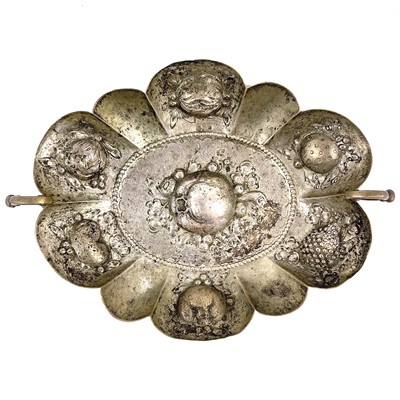 Lot 42 - A continental white metal twin handled lobed dish embossed with fruit.