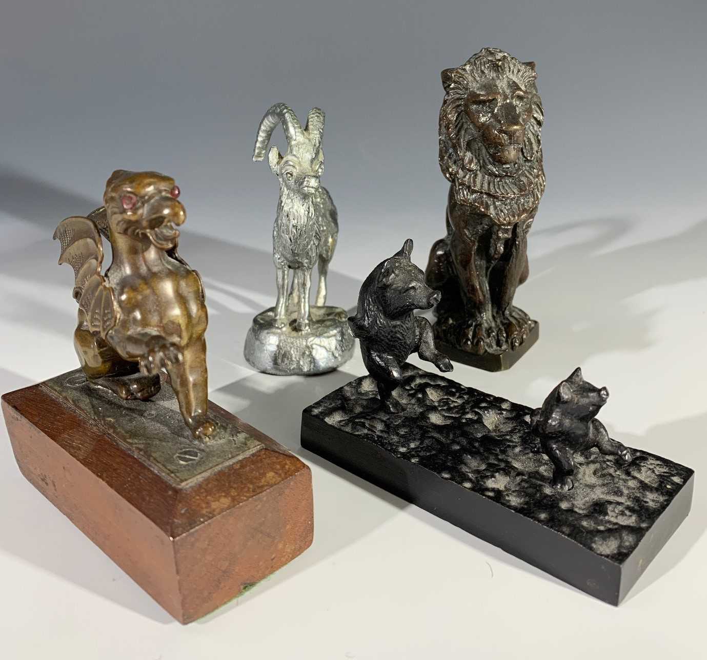 Lot 177 - A bronze lion sejant height 9.5cm, a bronze...