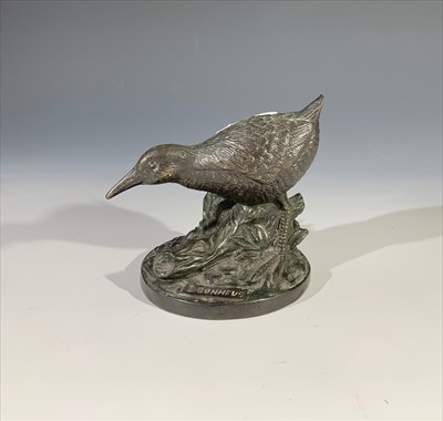 Lot 178 - A bronze model of a bird, on circular base...