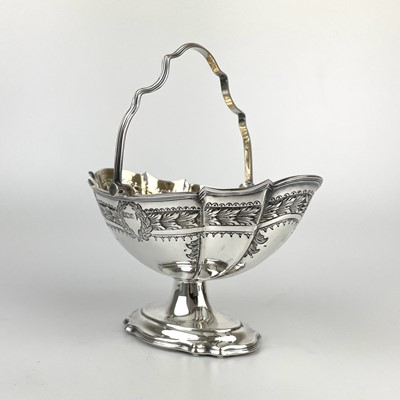 Lot 70 - An Edwardian silver swing handled pedestal basket by Walker & Hall.
