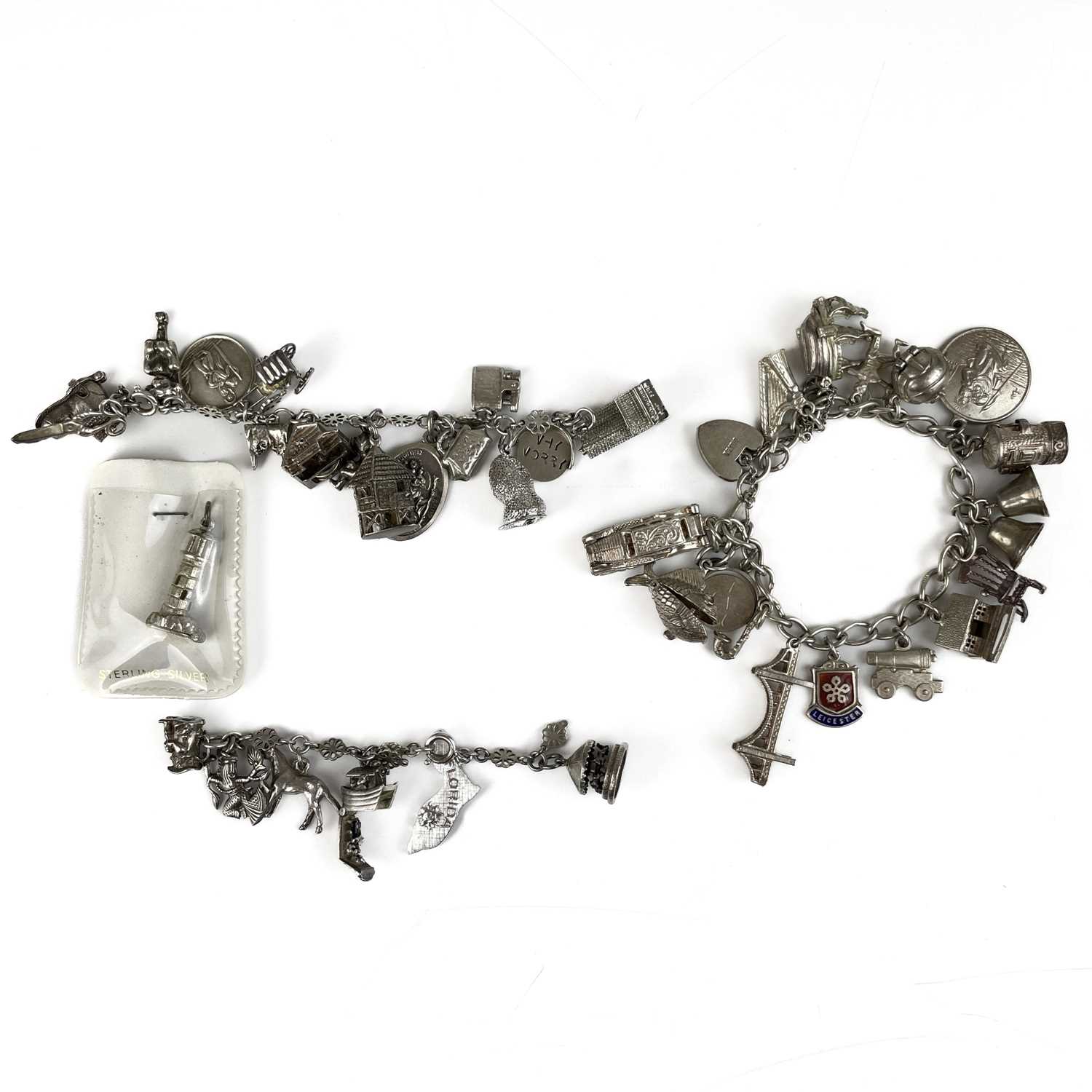 Lot 381 - Two silver charm bracelets.