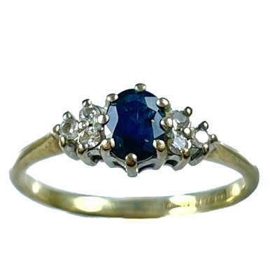 Lot 300 - An 9ct sapphire and diamond seven stone ring.