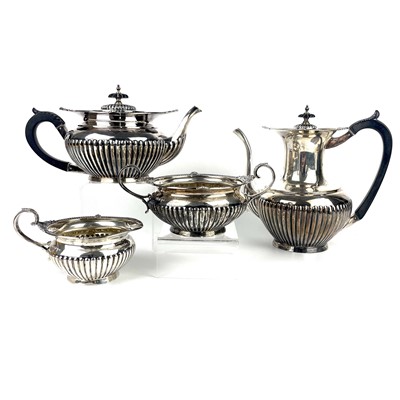 Lot 116 - An Edwardian silver four piece tea set by Walker & Hall.