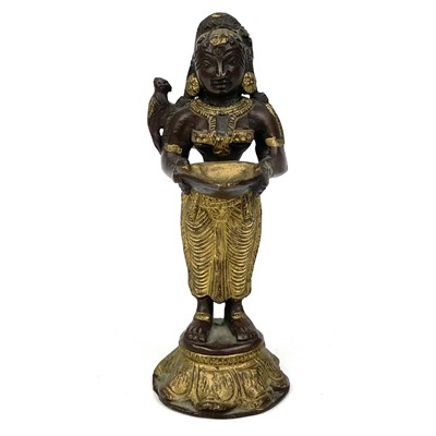 Lot 1012 - An Indian gilt bronze figural oil lamp.