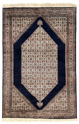 Lot 1277 - A Persian silk rug.