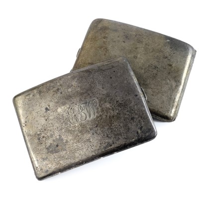 Lot 65 - Two silver cigarette cases and two napkin rings.