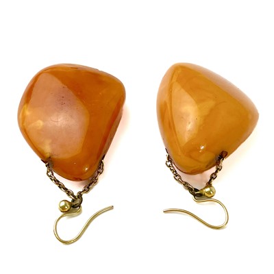 Lot 346 - A pair of Baltic yolk amber gold chain mounted pendant earrings.