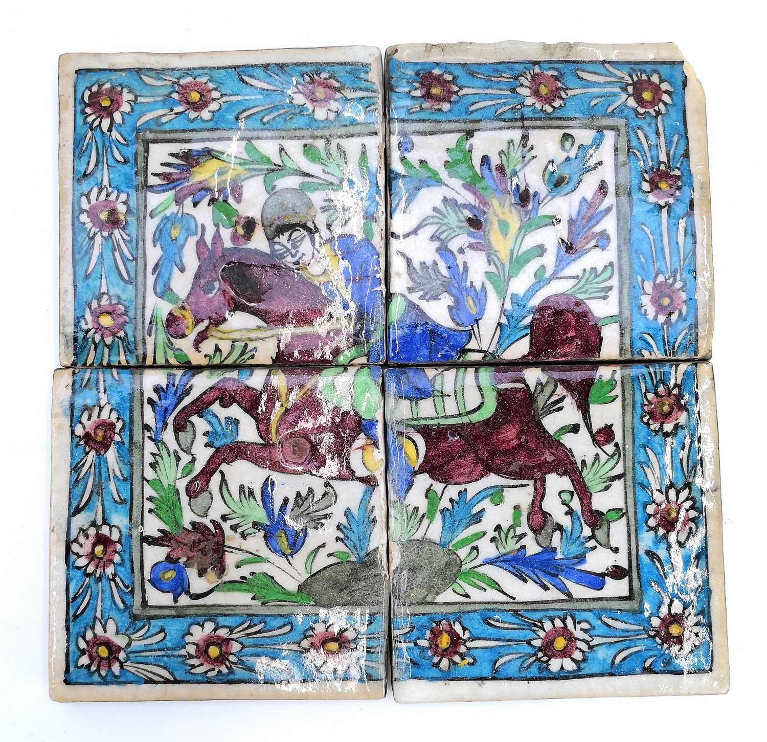 Lot 1019 - Four Persian pottery polychrome tiles, 19th century, Qajar Dynasty.