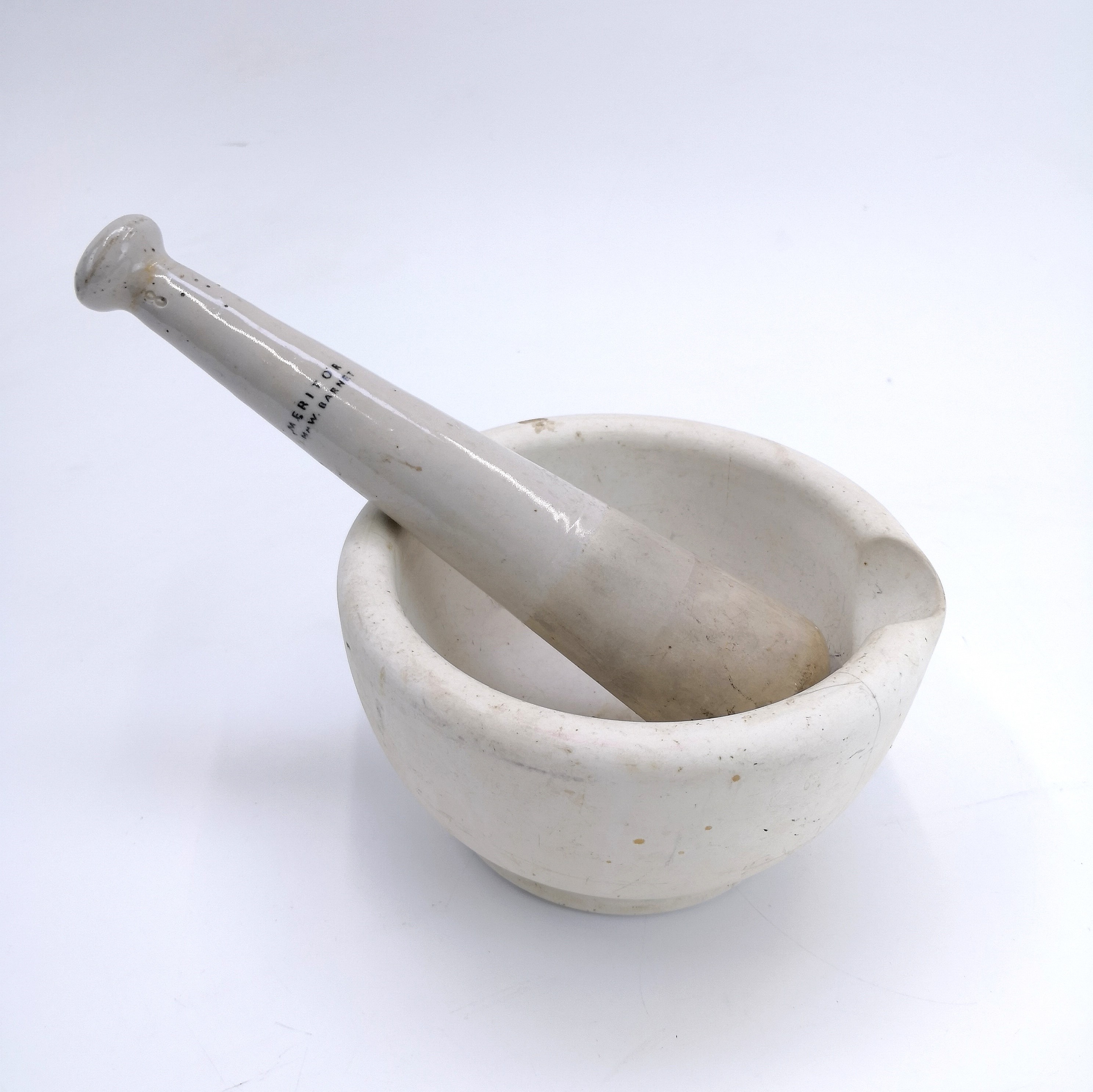 Lot 140 A mortar and pestle of large proportions.