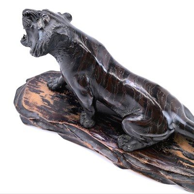 Lot 5 - A Japanese bronze model of a tiger, Meiji period, signed.