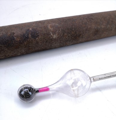 Lot 108 - A blown glass salinometer in a metal cylinder case.