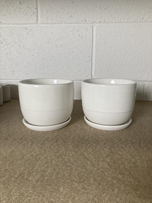 Lot 284 - A pair of white Kinto ceramic pots with...