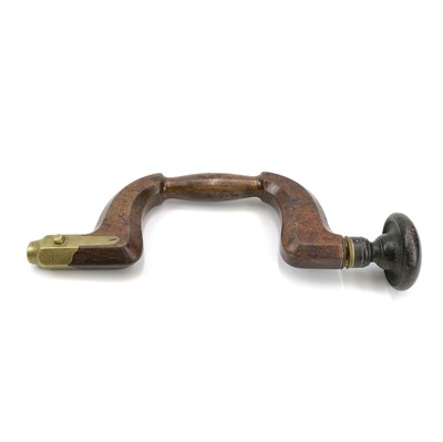 Lot 117 - A 19th century beech and brass mounted carpenter's brace stamped Bradshaw.