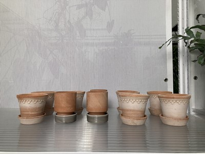 Lot 307 - Ten terracotta Bergs pots with saucers. Height...