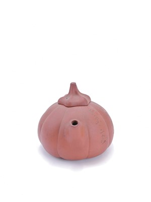 Lot 56 - A Chinese Yixing pottery teapot, 19th century.