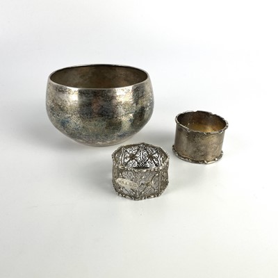 Lot 32 - A silver hammered bowl and two silver napkin rings.