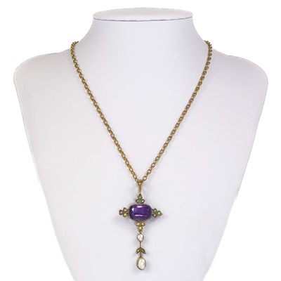 Lot 13 - An Edwardian gold amethyst and pearl set pendant.