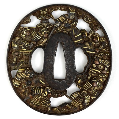 Lot 6 - A Japanese iron and gold decorated tsuba, Edo Period.