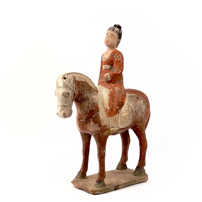 Lot 43 - A Chinese terracotta pottery equestrian figure, Tang Dynasty. (618-907)