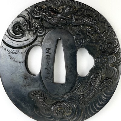 Lot 7 - A Japanese bronze tsuba, Edo Period.