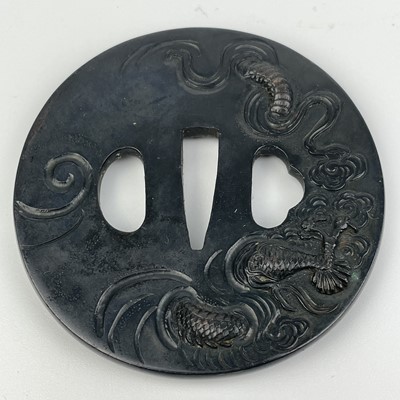 Lot 7 - A Japanese bronze tsuba, Edo Period.