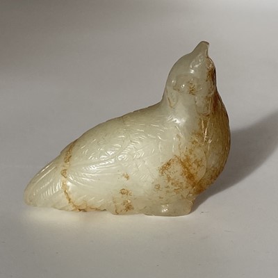 Lot 11 - A Chinese carved jade and russet chicken, Qing Dynasty.