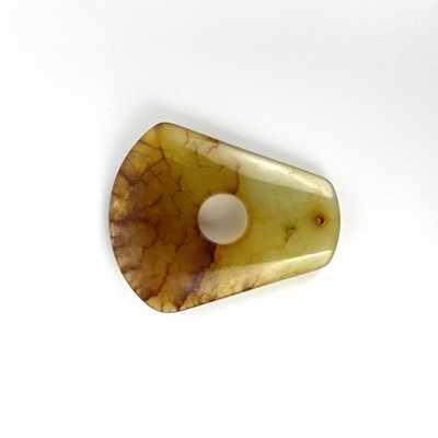 Lot 21 - A Chinese russet jade pendant, Qing Dynasty.