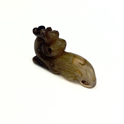 Lot 23 - A Chinese carved jade kylin, Qing Dynasty.