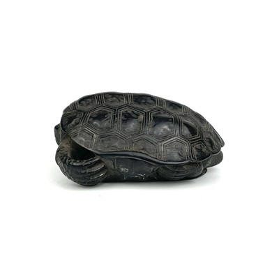 Lot 24 - A Japanese carved wood netsuke in the form of a turtle, 19th century.