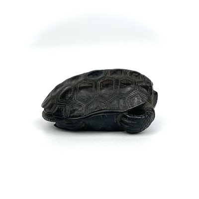 Lot 24 - A Japanese carved wood netsuke in the form of a turtle, 19th century.