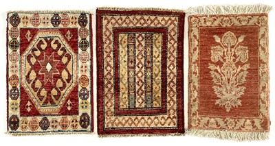 Lot 1254 - A small Indian rug.