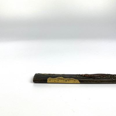 Lot 25 - A Japanese bronze and gold kozuka, (knife handle) Edo period, signed.