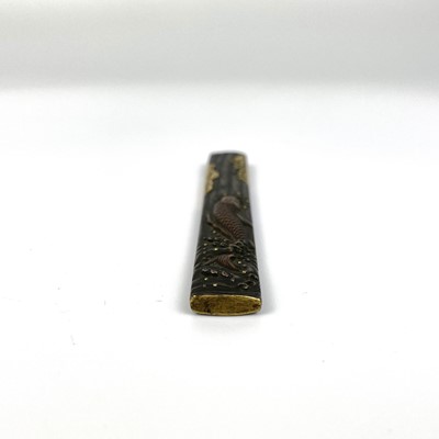 Lot 25 - A Japanese bronze and gold kozuka, (knife handle) Edo period, signed.