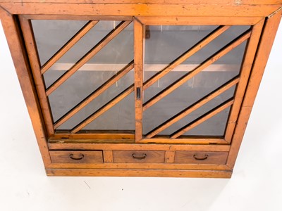 Lot 35 - A Japanese elm and pine glazed cabinet, Meiji period, 19th century.