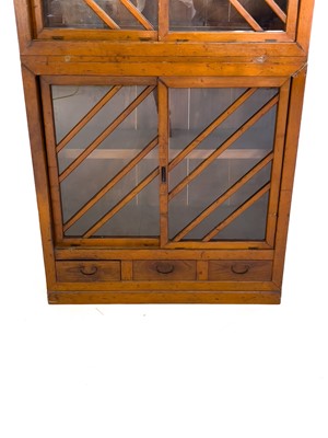 Lot 35 - A Japanese elm and pine glazed cabinet, Meiji period, 19th century.