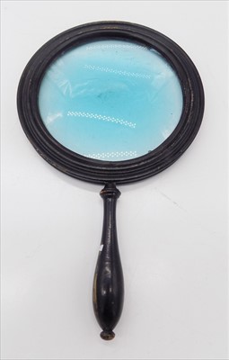 Lot 194 - A Georgian ebonised magnifying glass.