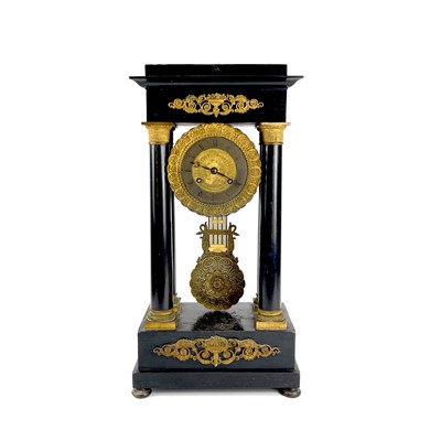 Lot 1709 - A French ebonised and ormolu portico clock.