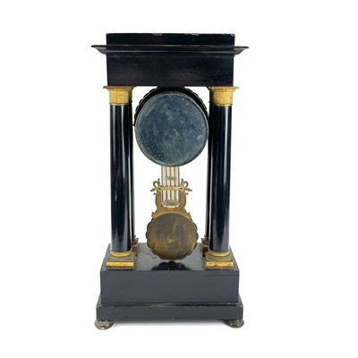 Lot 1709 - A French ebonised and ormolu portico clock.