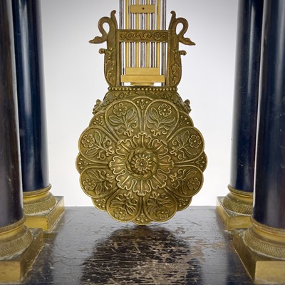 Lot 1709 - A French ebonised and ormolu portico clock.