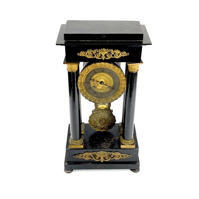 Lot 1709 - A French ebonised and ormolu portico clock.