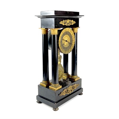 Lot 1709 - A French ebonised and ormolu portico clock.