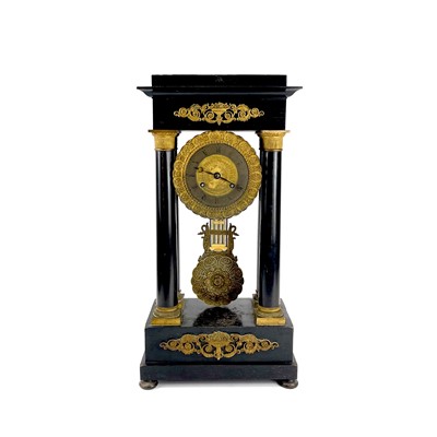 Lot 1709 - A French ebonised and ormolu portico clock.