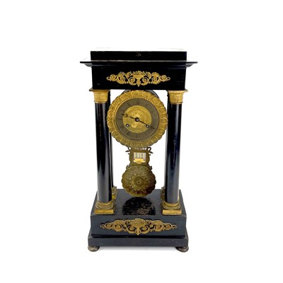 Lot 1709 - A French ebonised and ormolu portico clock.