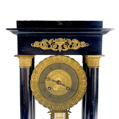 Lot 1709 - A French ebonised and ormolu portico clock.