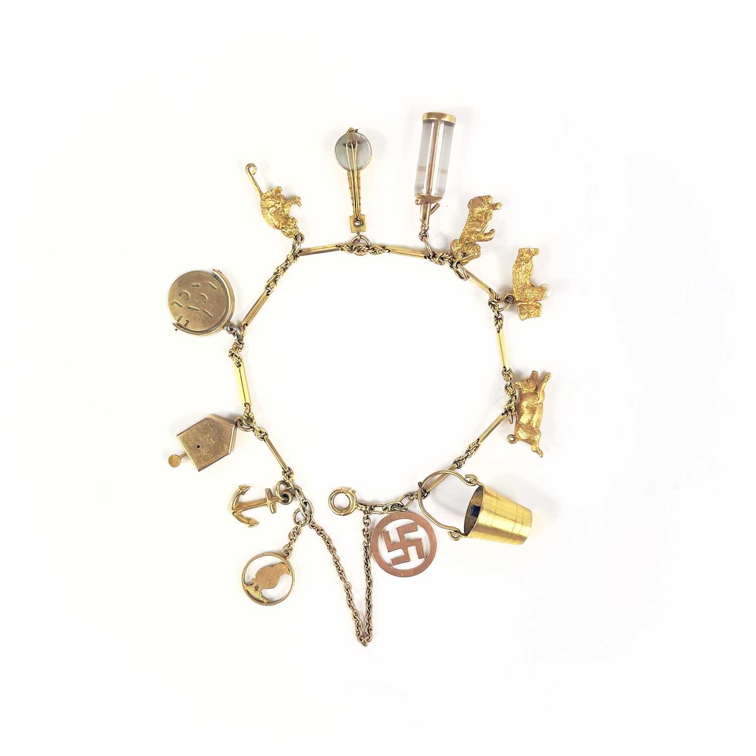 Lot 106 - A 9ct gold charm bracelet.