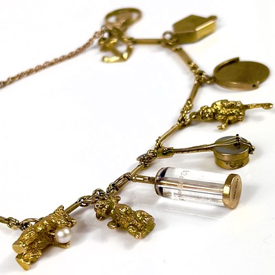 Lot 106 - A 9ct gold charm bracelet.