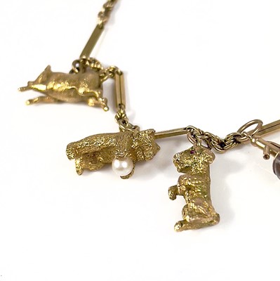Lot 106 - A 9ct gold charm bracelet.