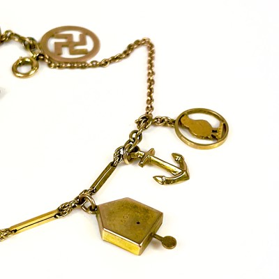 Lot 106 - A 9ct gold charm bracelet.